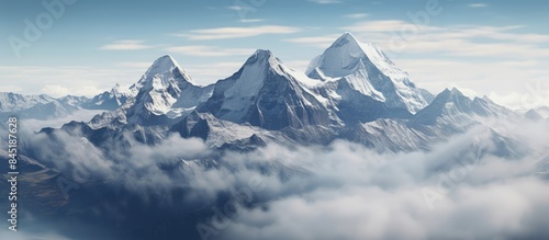 Wallpaper Mural The tall rocky mountains are covered in thick fog, and covered in snow while the sky is bright blue Torontodigital.ca
