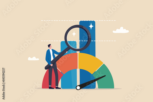 Benchmark performance or KPI key performance indicator, metrics or measurement to measure success, result evaluation, analysis or comparison concept, businessman magnify benchmark metric graph scale. photo