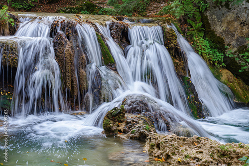 Generative ai on theme of beautiful majestic waterfall in natural nature, national park attraction
