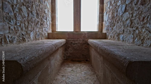 The stone benches at the Chlemoutsi Castle Museum in Kastro, Greece. photo