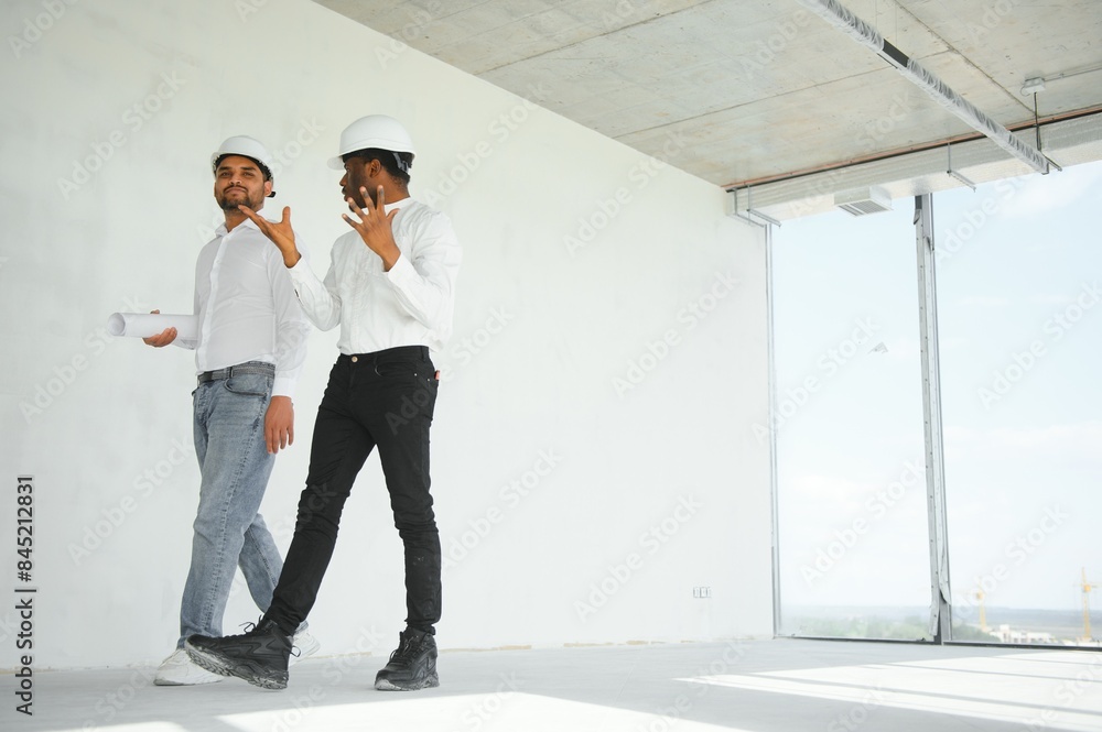Fototapeta premium Group of multi ethnic engineer construction site worker meeting at workplace