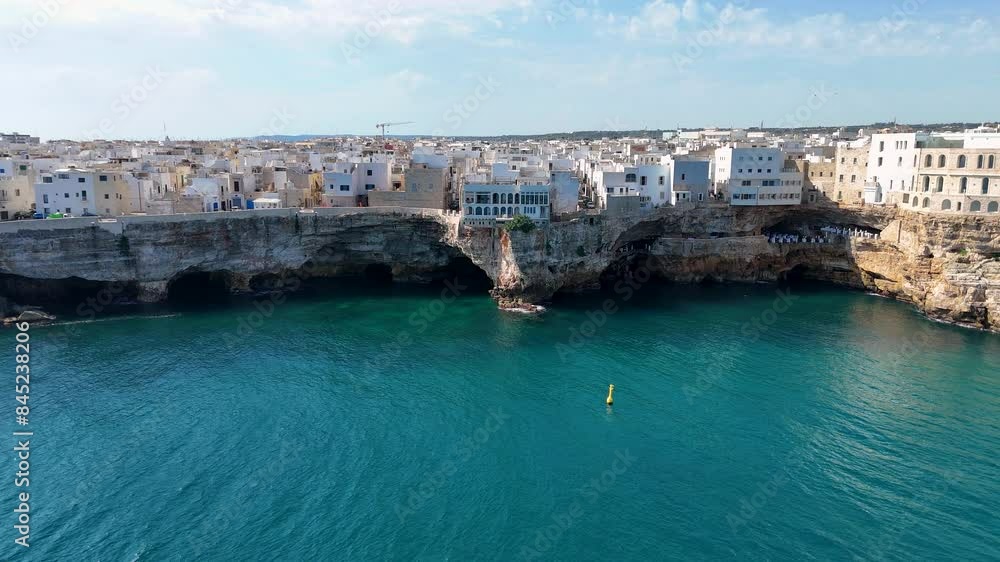 Slow Aerial Reveal of the Rugged Shoreline of Polignano A Mare, Puglia, Italy Slow Aerial Reveal of the Rugged Shoreline of Polignano A Mare, Puglia, Italy