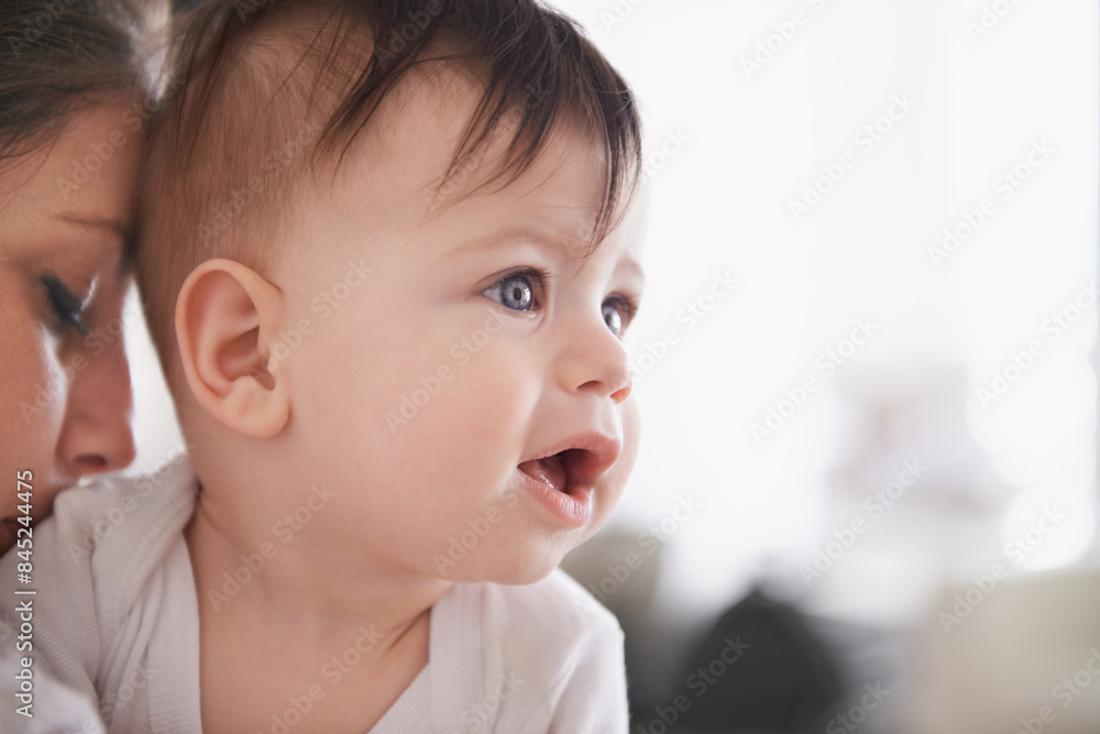 Baby boy, mama and affection while holding infant, growth and child development with love hug. Care, mother and curious mind with parent, bonding together in family home with kid in embrace Baby boy, mama and affection while holding infant, growth and child development with love hug. Care, mother and curious mind with parent, bonding together in family home with kid in embrace