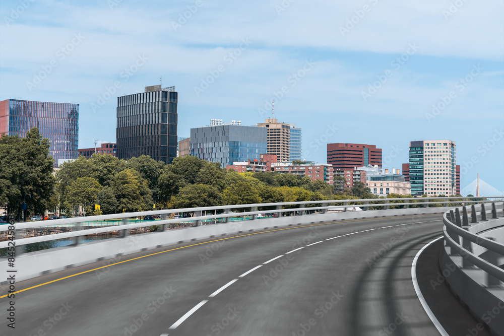 Fototapeta premium Empty urban asphalt road exterior with city buildings background. New modern highway concrete construction. Concept of way to success. Transportation logistic industry fast delivery. Boston. USA.