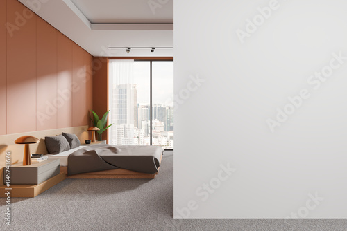 Orange home bedroom interior with bed and nightstand, window. Mockup wall