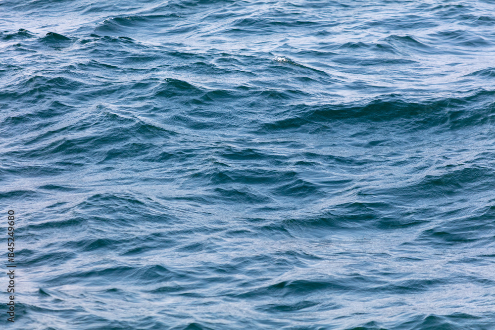 Blue water in the sea as an abstract background. Texture Blue water in the sea as an abstract background. Texture