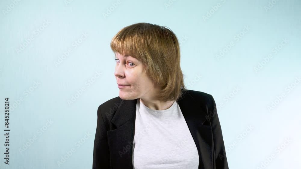 A young woman looks with curiosity, leaning forward to see more A young woman looks with curiosity, leaning forward to see more