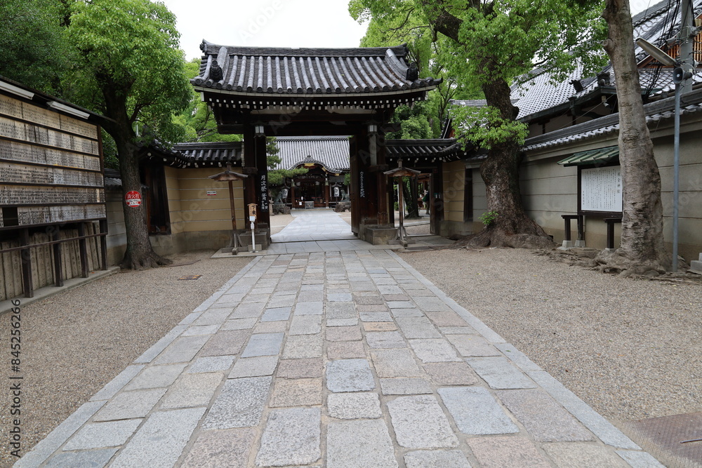 A Japanese shrine : a scene of the access and the entrance gate to the precincts of Kumata-jinjya Shrine in Osaka City in Japan A Japanese shrine : a scene of the access and the entrance gate to the precincts of Kumata-jinjya Shrine in Osaka City in Japan