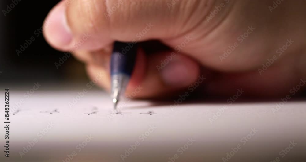 Blurry close-up of an individual's hand while scribbling some notes using a pen on a clean white sheet of paper. Blurry close-up of an individual's hand while scribbling some notes using a pen on a clean white sheet of paper.