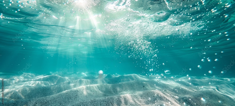 Fototapeta premium Underwater turquoise texture in the ocean. Bubbles in the tropical sea.