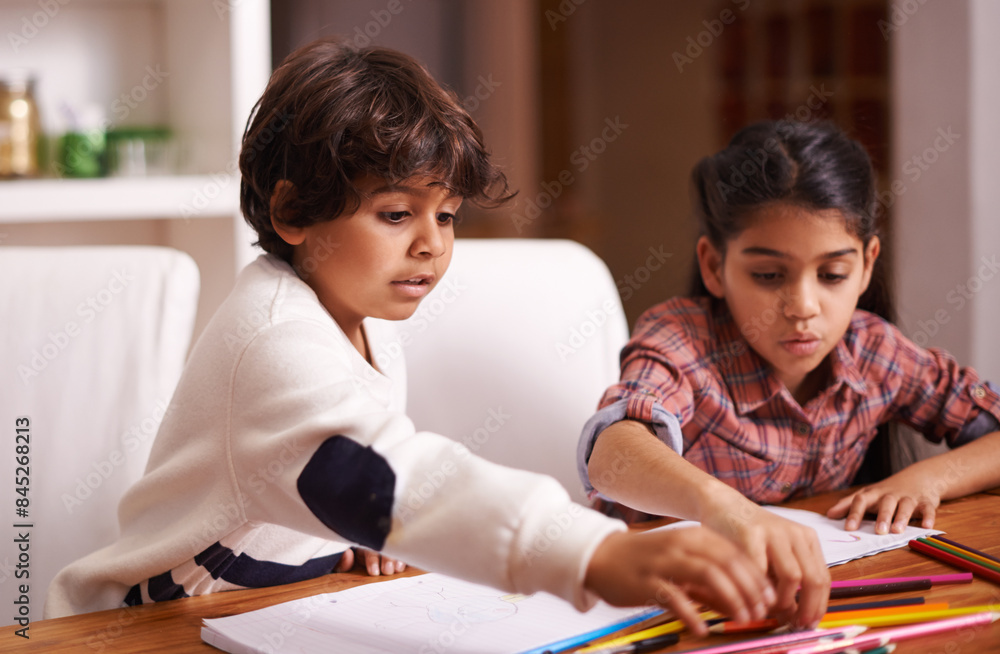 Sibling, children and home for writing, learning and education with school books, color pencil and drawing. Students, girl and boy or kids with language development, homework and creativity at table Sibling, children and home for writing, learning and education with school books, color pencil and drawing. Students, girl and boy or kids with language development, homework and creativity at table