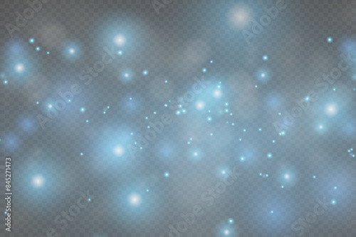 Blue sparkles sparkle with a special lighting effect. Sparkling magical dust particles.