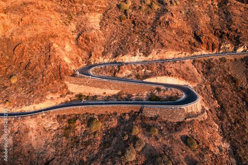 Winding road leading to Pico de Las Nieves mountains on sunny day in Las Palmas de Gran Canaria, Spain
