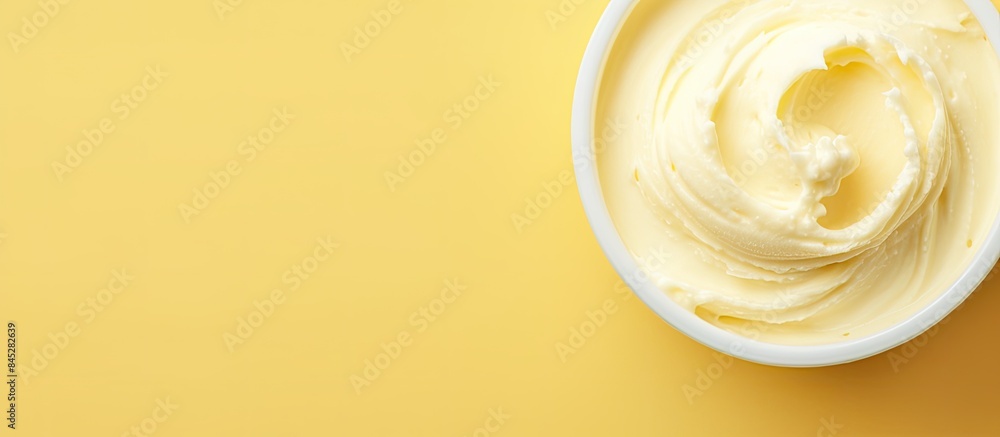Top view of a copy space image featuring a background of scooped vanilla ice cream portraying a summer food concept The image showcases a texture reminiscent of sweet yogurt dessert or yellow ice cre Top view of a copy space image featuring a background of scooped vanilla ice cream portraying a summer food concept The image showcases a texture reminiscent of sweet yogurt dessert or yellow ice cre