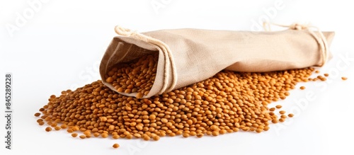 A copy space image of dry uncooked lentils in a white paper bag isolated on a white background captured with soft light in a studio setting Perfect for a festive dish during Christmas and New Year ce