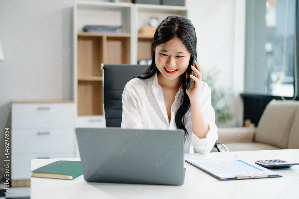 businesswoman working at office with laptop, tablet and taking notes on the paper.. businesswoman working at office with laptop, tablet and taking notes on the paper..