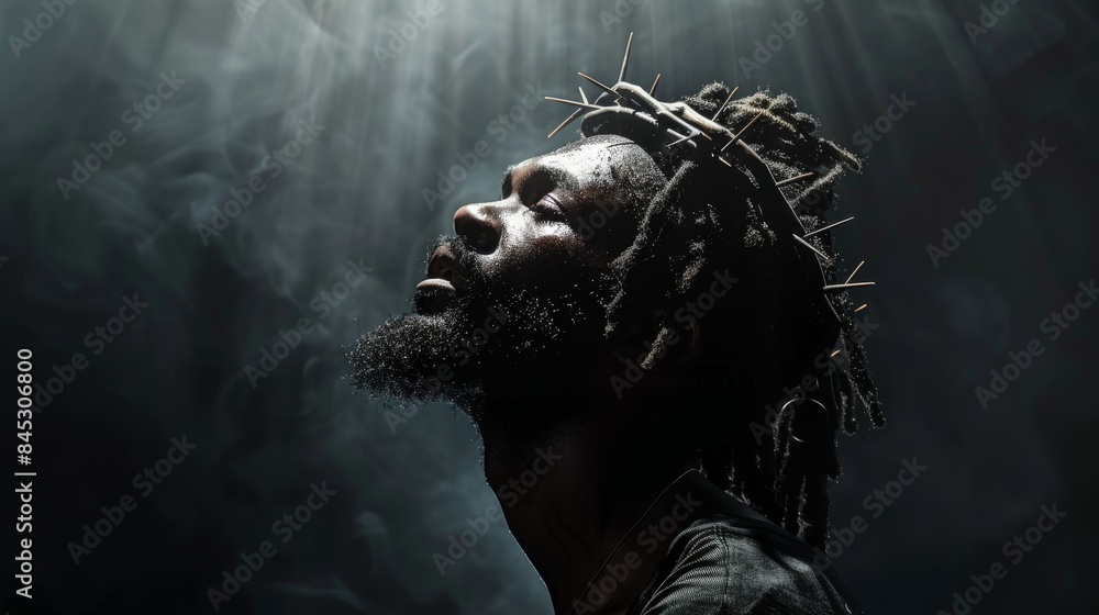 Dramatic portrait of black Jesus Christ with crown of thorns Dramatic portrait of black Jesus Christ with crown of thorns