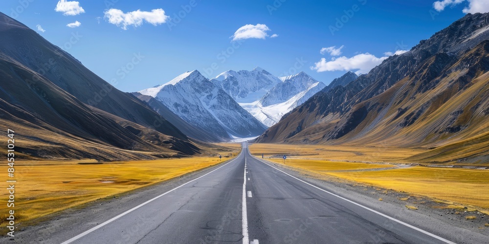 Empty highway between mountain peaks, clear sunny day, incredible nature, bright saturated colors