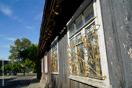 Traditional wooden Karaim house painted - close-up on window - Trakai, Lithuania