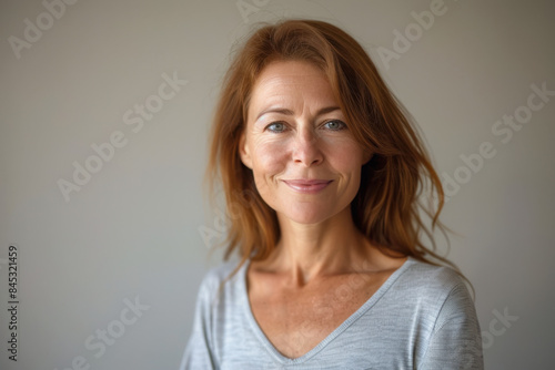 A close up portrait of a woman with a subtle smile © MagnusCort