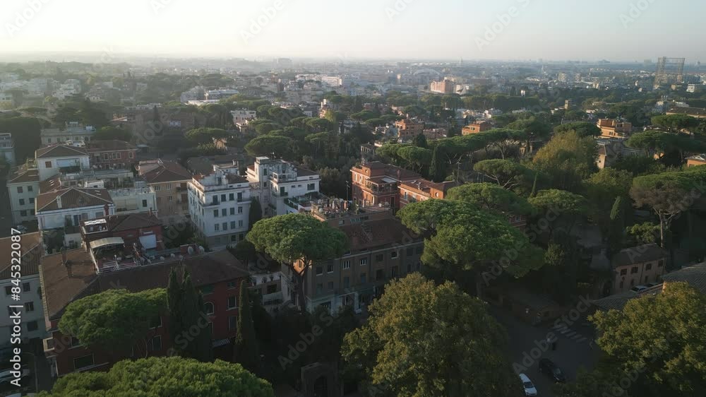 Establishing dolly above trees to old historic white brick buildings of Orange Garden Rome Italy Establishing dolly above trees to old historic white brick buildings of Orange Garden Rome Italy