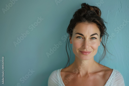 A close up portrait of a woman with a subtle smile