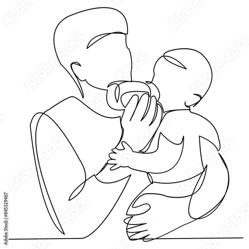 Dad feeds the baby from the bottle