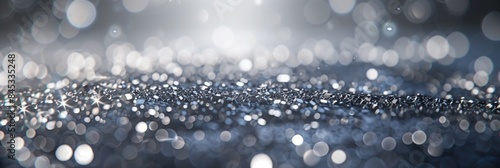 A shimmering bokeh background in silver tones, ideal for elegant and festive designs. photo