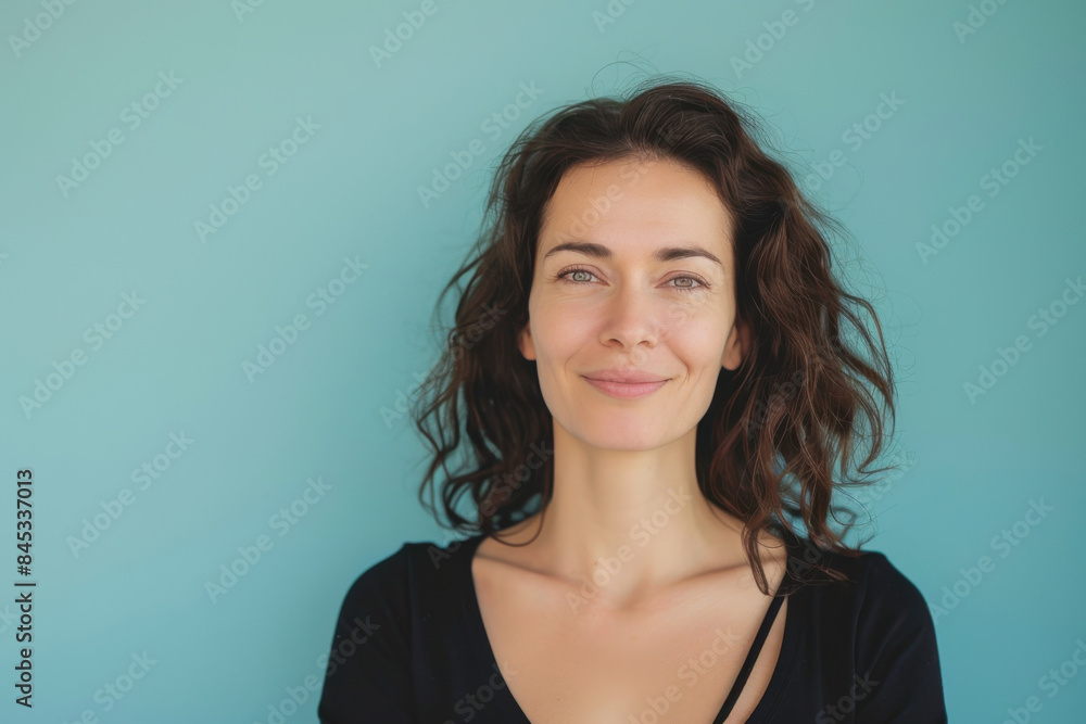A close up portrait of a woman with a subtle smile A close up portrait of a woman with a subtle smile