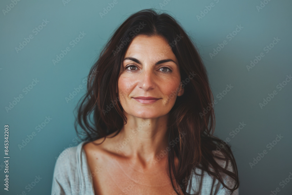 A close up portrait of a woman with a subtle smile A close up portrait of a woman with a subtle smile