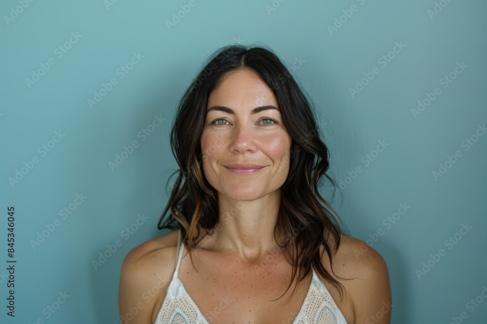 A close up portrait of a woman with a subtle smile A close up portrait of a woman with a subtle smile