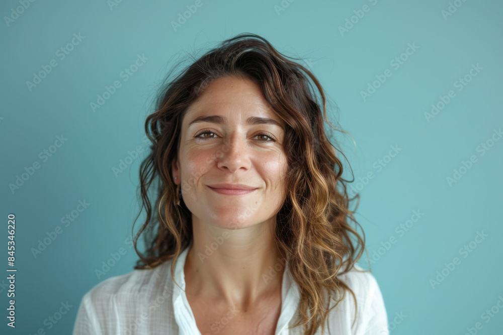 A close up portrait of a woman with a subtle smile A close up portrait of a woman with a subtle smile