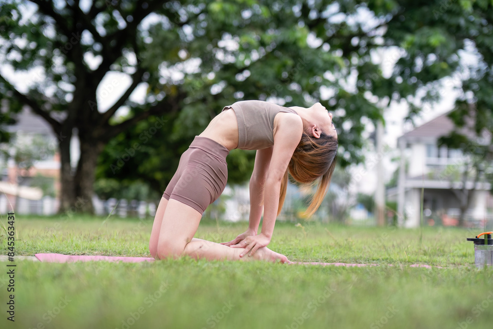 Woman Practice Yoga in Park. Healthy Lifestyle, Stretching, and Fitness Outdoors in Nature Woman Practice Yoga in Park. Healthy Lifestyle, Stretching, and Fitness Outdoors in Nature