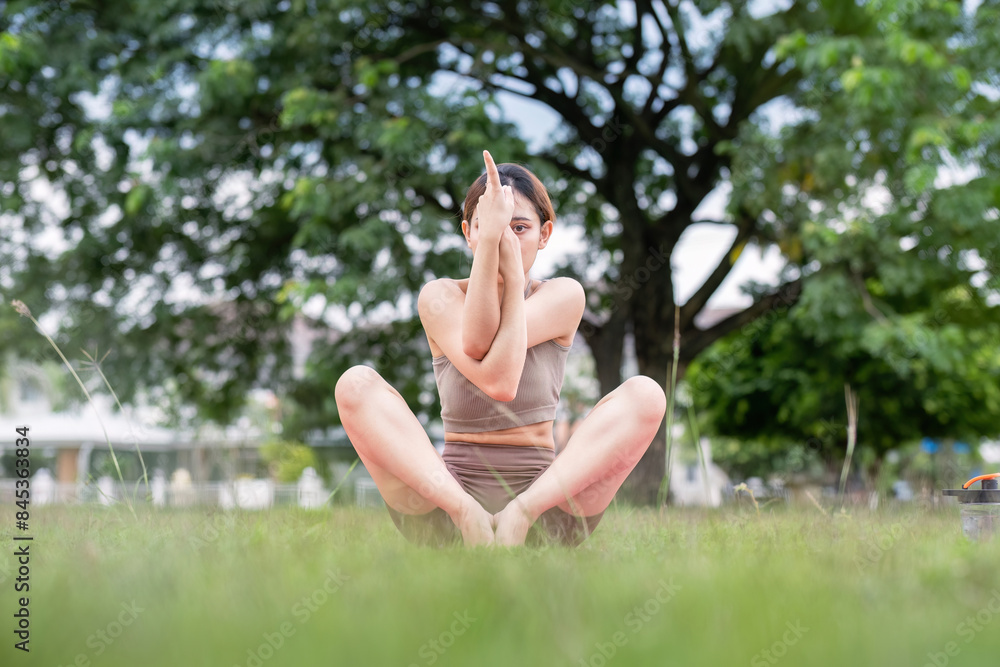 Woman Practice Yoga in Park. Healthy Lifestyle, Outdoor Exercise, Stretching, and Mindfulness in Nature. Perfect for Wellness, Fitness, and Healthy Living Concepts Woman Practice Yoga in Park. Healthy Lifestyle, Outdoor Exercise, Stretching, and Mindfulness in Nature. Perfect for Wellness, Fitness, and Healthy Living Concepts