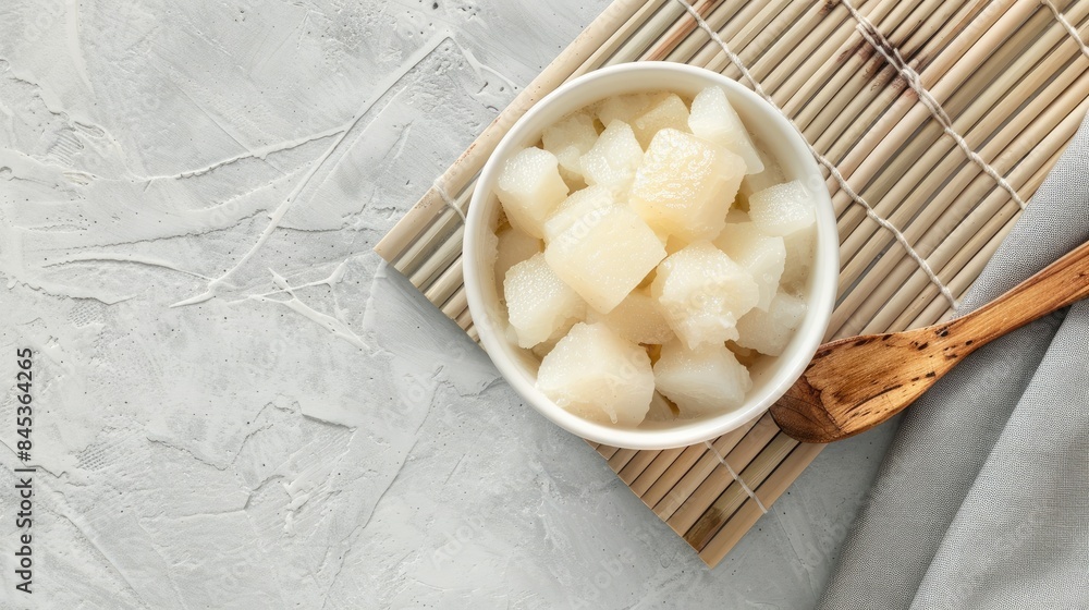 a coconut milk-based dessert with young pineapple and fresh banana, placed on an isolated white background. a coconut milk-based dessert with young pineapple and fresh banana, placed on an isolated white background.