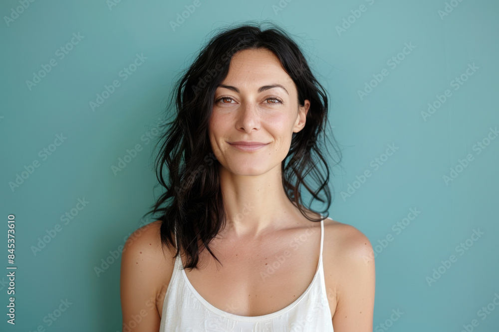 A close up portrait of a woman with a subtle smile A close up portrait of a woman with a subtle smile