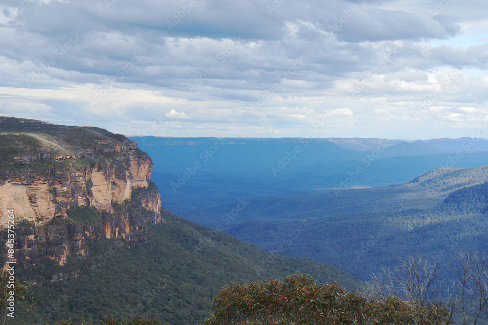 Landscape of The Three Sisters are an unusual rock formation in the Blue Mountains National Park of Katoomba , New South Wales, Australia, on the north escarpment of the Jamison Valley - Nature Track Landscape of The Three Sisters are an unusual rock formation in the Blue Mountains National Park of Katoomba , New South Wales, Australia, on the north escarpment of the Jamison Valley - Nature Track