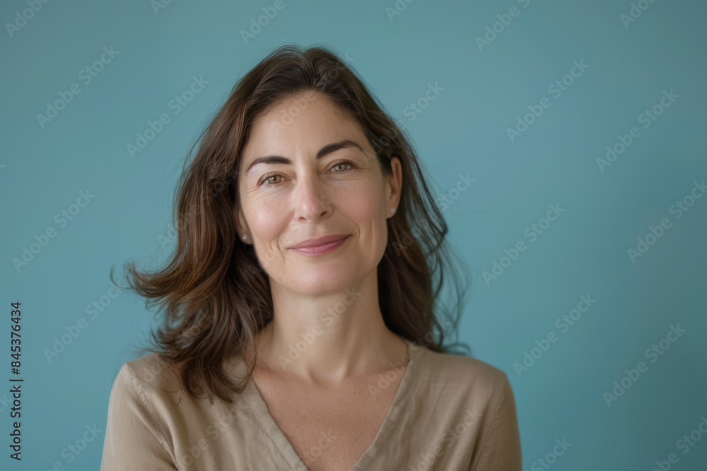 Fototapeta premium A close up portrait of a woman with a subtle smile