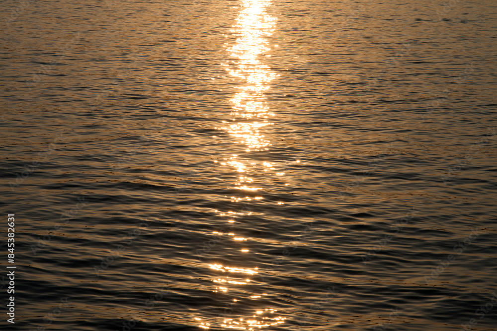 View of the sunlight reflection on the sea during sunset View of the sunlight reflection on the sea during sunset