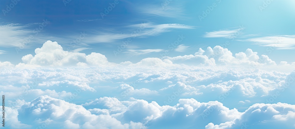 Wonderful view from the airplane window flying above the clouds Cumulus clouds with blue sky in sunny day and soft sunlight in the afternoon Nature background. Creative banner. Copyspace image Wonderful view from the airplane window flying above the clouds Cumulus clouds with blue sky in sunny day and soft sunlight in the afternoon Nature background. Creative banner. Copyspace image