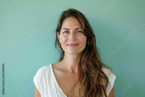 A close up portrait of a woman with a subtle smile