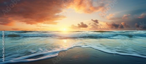 Sunrise reflecting on waves at the beach. Creative banner. Copyspace image © HN Works