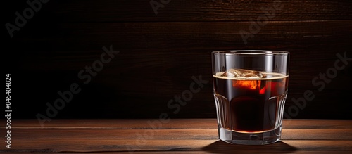 Black coffee in a glass placed on a brown background. Creative banner. Copyspace image photo
