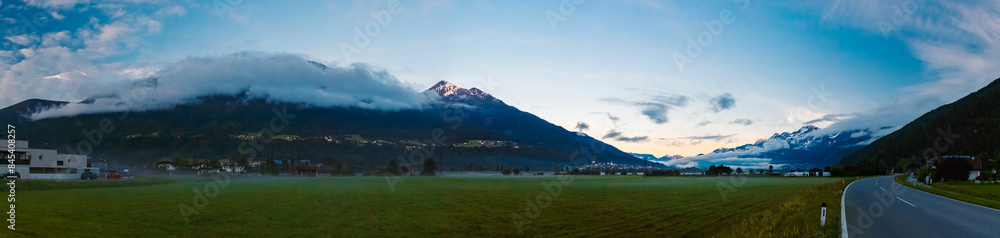 High resolution stitched alpine summer sunrise panorama with dramatic clouds at Pettnau, Innsbruck, Tyrol, Austria High resolution stitched alpine summer sunrise panorama with dramatic clouds at Pettnau, Innsbruck, Tyrol, Austria