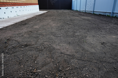 Preparing the site for sowing lawn grass, leveling the soil