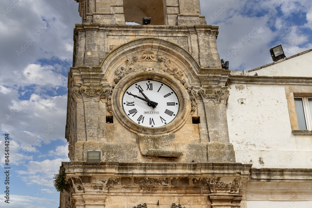 Civic Tower (Torre dell'Orologio) next to University Palace, located in Plebiscito Square, Martina Franca, Italy, Apulia