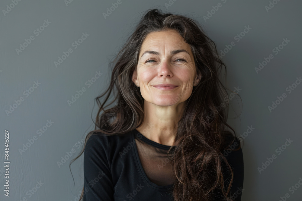 Fototapeta premium A close up portrait of a woman with a subtle smile