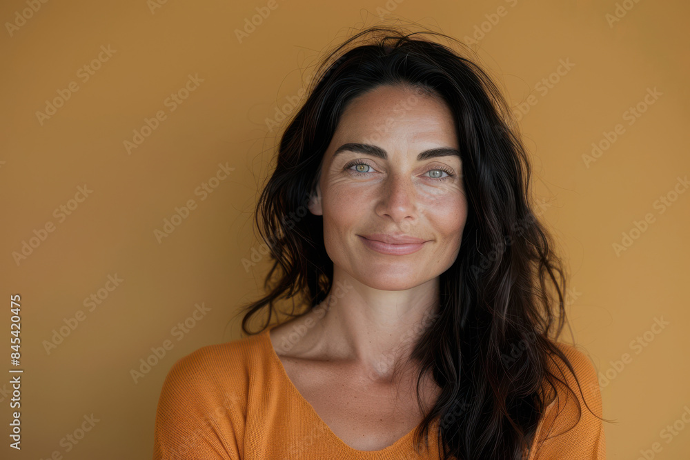 A close up portrait of a woman with a subtle smile A close up portrait of a woman with a subtle smile
