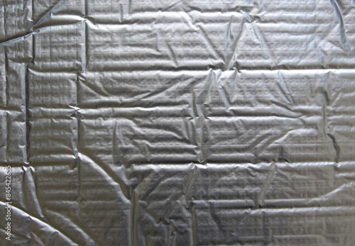 Sound deadening mat puffy metallic industrial background photo