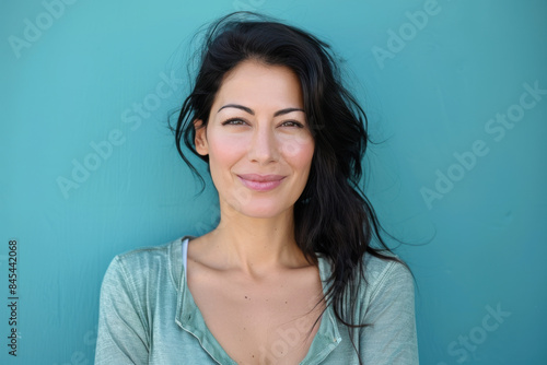 A close up portrait of a woman with a subtle smile